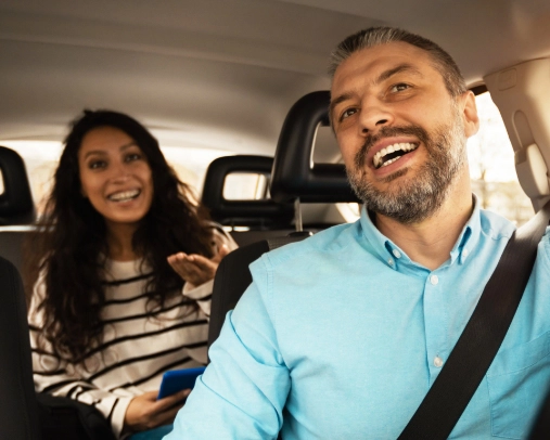 Man and woman driving in a car